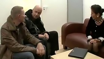 A Mature German Woman With Unshaven Pubic Hair Engages In Sexual Activity With Two Men, Including One Who Is Using A Computer