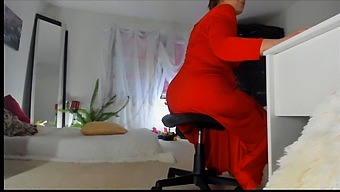Sonya, A Naughty Milf, Seductively Posing In A Long Red Dress